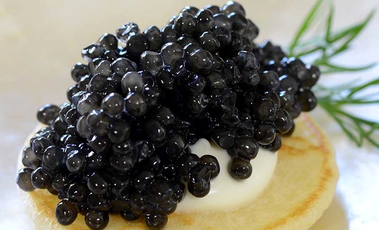 Example of serving black caviar with bliny, photo by Gourmet Food Store