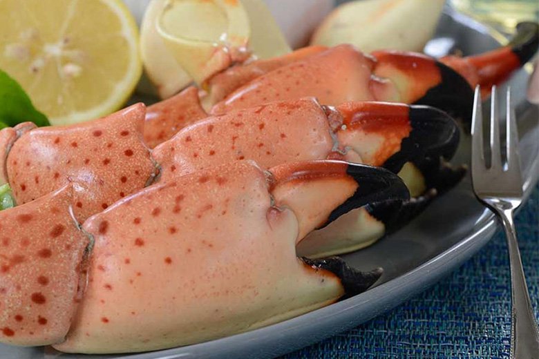 King crab legs served with lemon wedges, photo by Gourmet Food Store