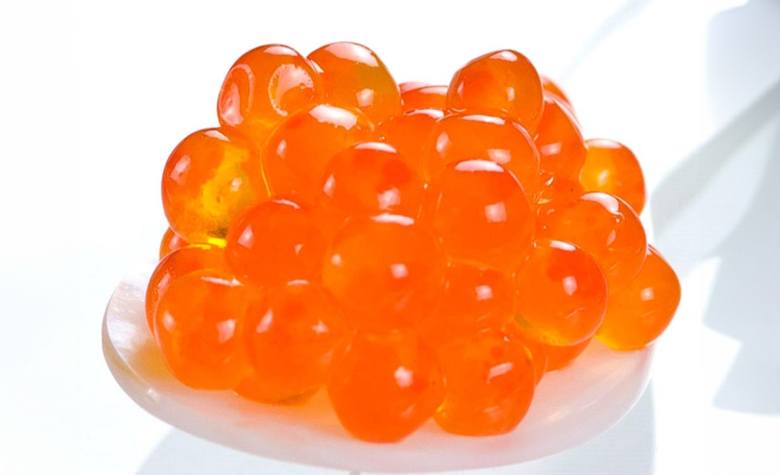 A portion of red Salmon caviar, photo by Gourmet Food Store