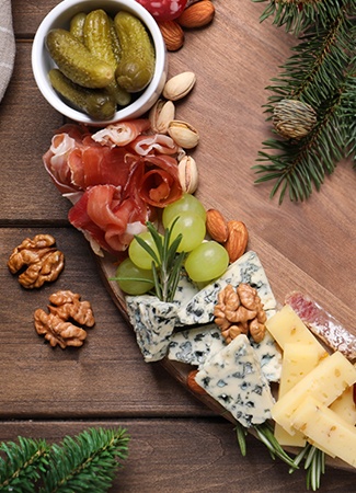  an assortment of fall cheeses on a board, gourmet food store