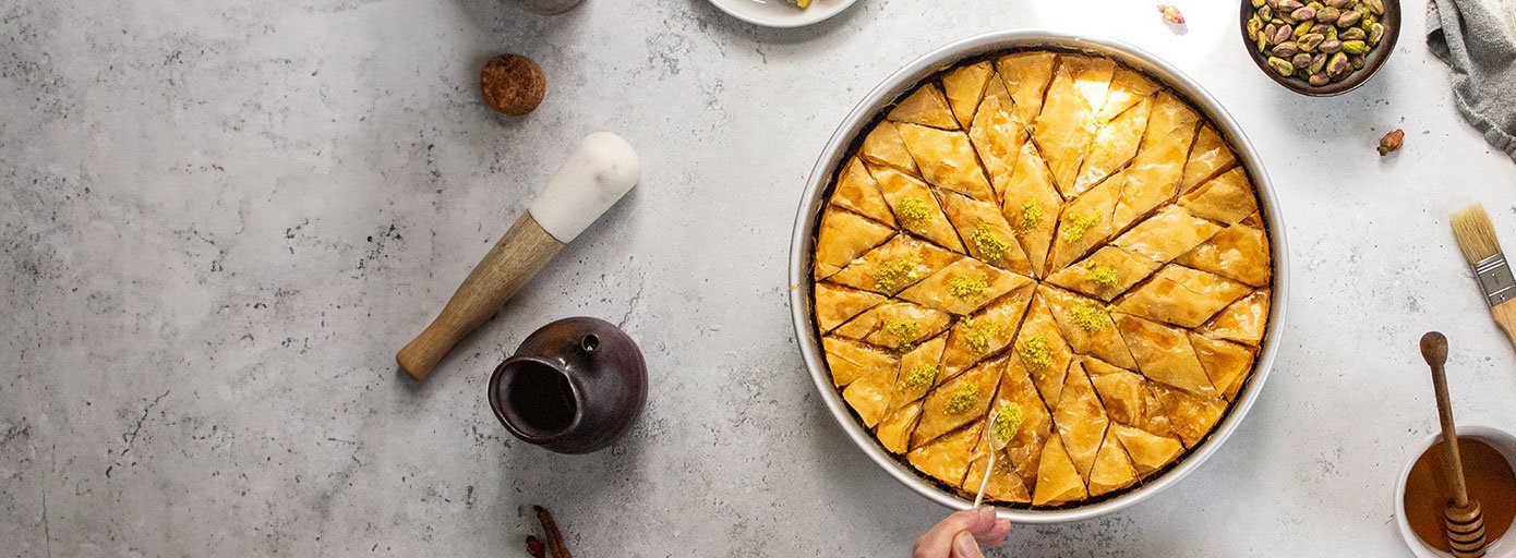 Image of flaky pistachio baklava Turkish dessert, by Gourmet Food Store