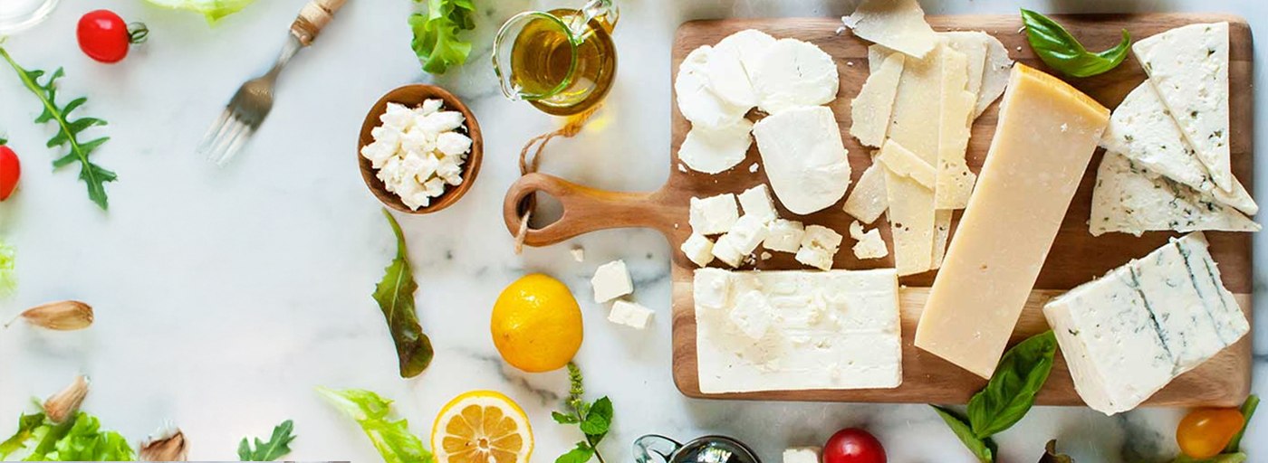 view of delicious cheeses on a board